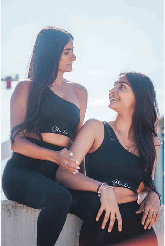 Monletics- black one shoulder sports bra facing forward